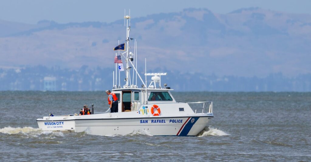 San Rafael police boat Mission City patrolling coastal waters under a clear sky.