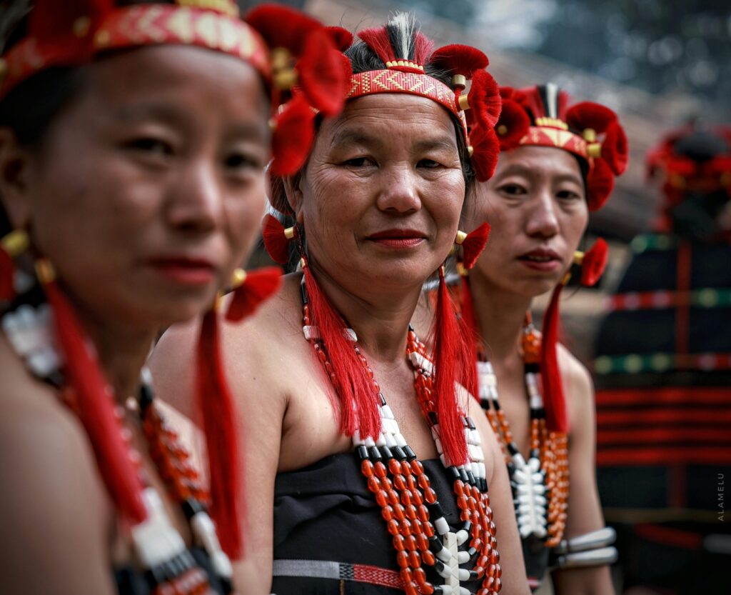 Naga women in vibrant tribal clothing during a cultural festival in Nagaland.