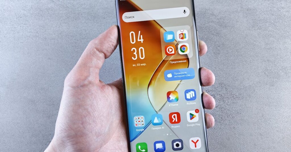 Close-up of a hand holding a smartphone displaying apps on the screen against a textured background.