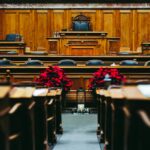 Spacious and elegant wooden courtroom with empty seats, located in Bern, Switzerland.