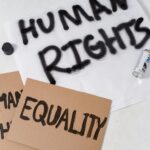 Close-up of protest materials promoting human rights and equality.